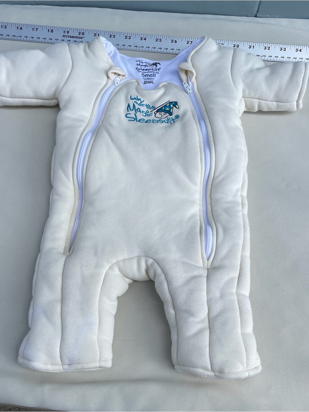 Baby Merlin’s magic sleepsuit in Cream with Dual Zippers